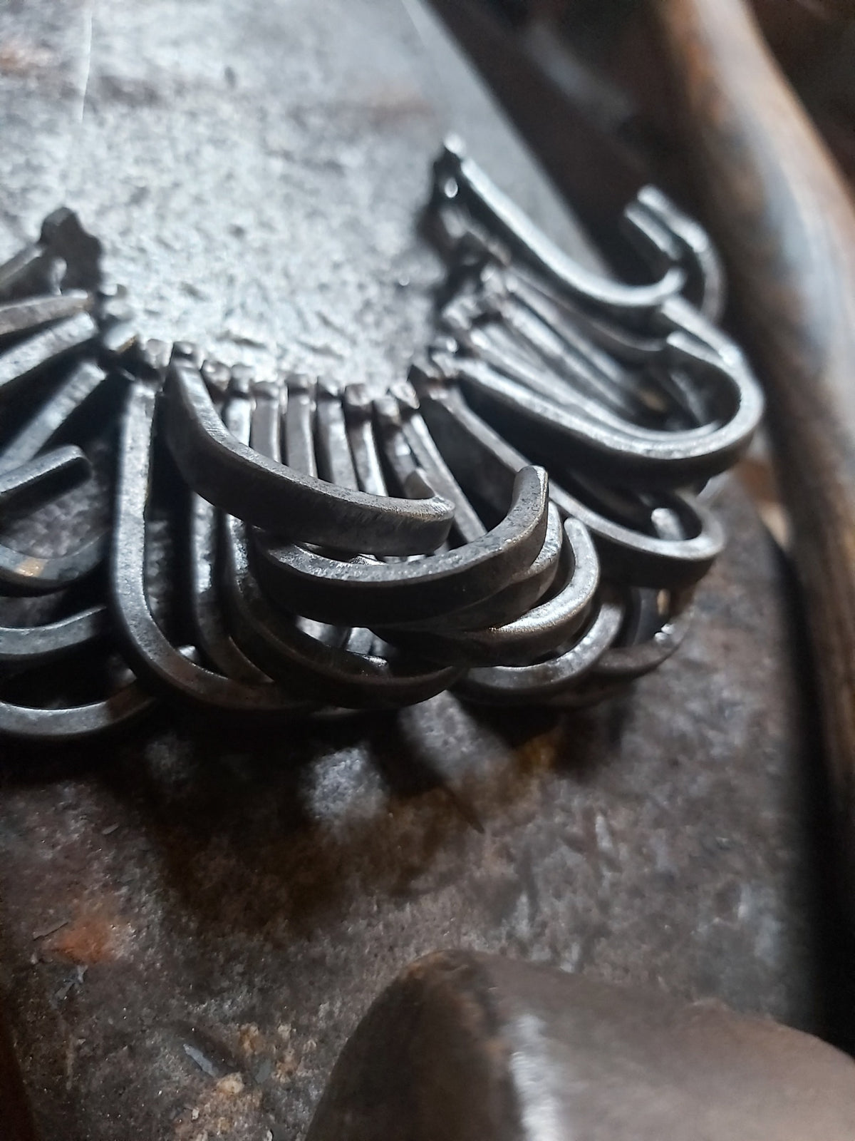 Group of plain hand-forged hooks