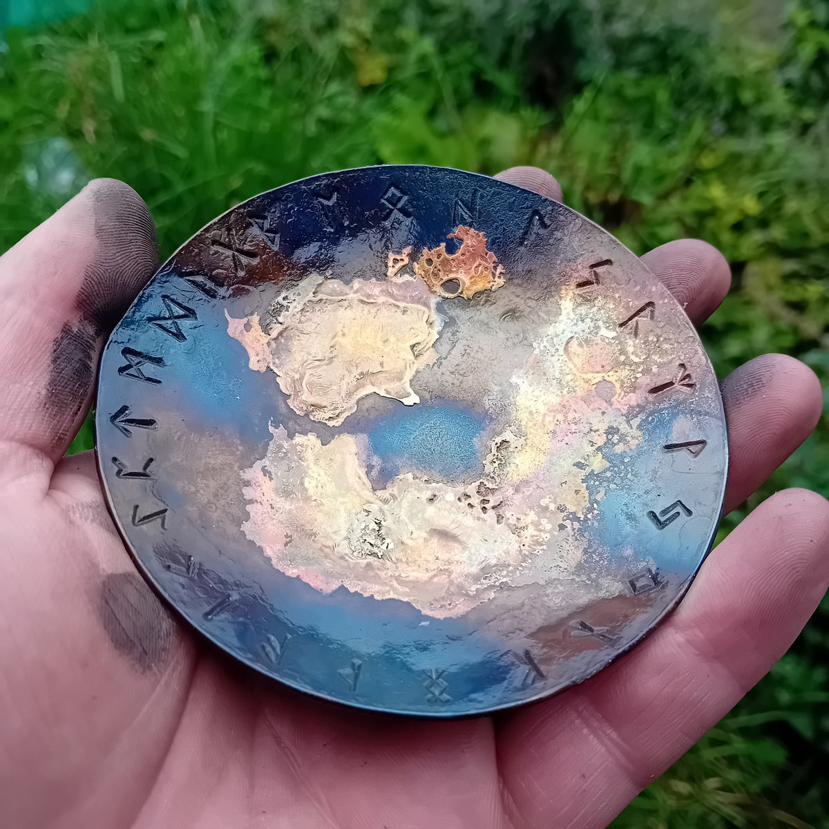 Handmade Rune Galaxy Bowl held in hand outdoors showing Elder Futhark runes