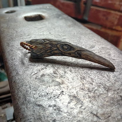 Hand-carved Orkney Boreray horn raven pendant with twisted brass hanging loop