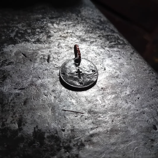 Hand-forged small steel cross talisman pendant with twisted copper loop
