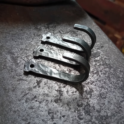 Three undecorated hand-forged hooks
