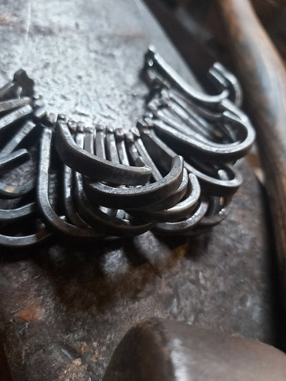 Group of plain hand-forged hooks